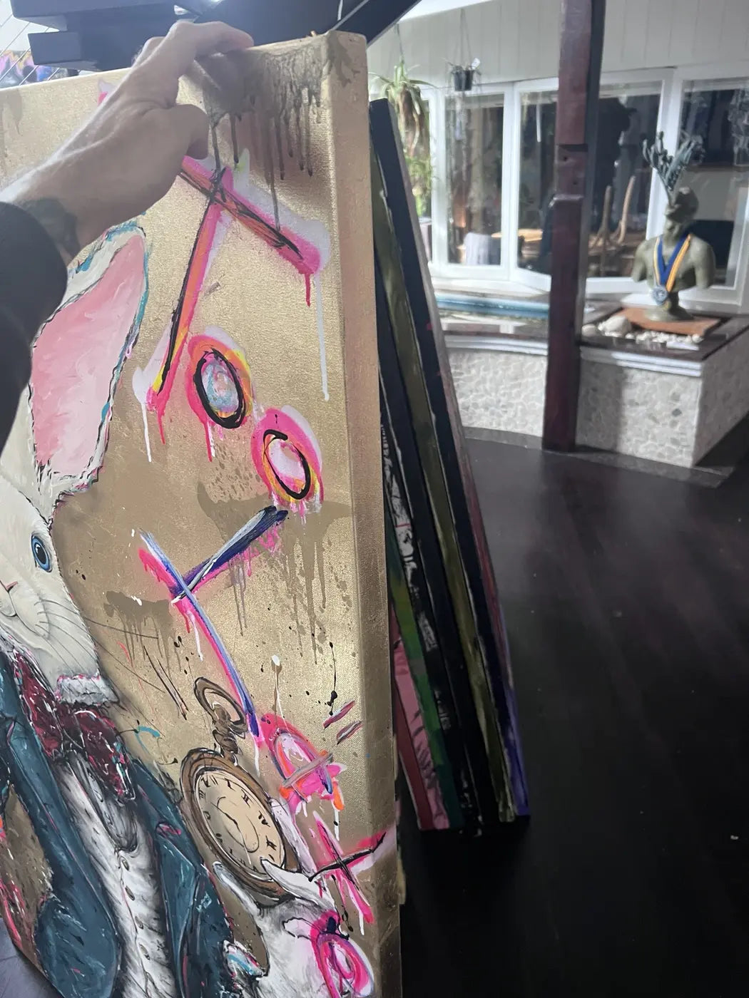 Angled side view showing the gold-toned painted canvas edge of Never too late – Party time.