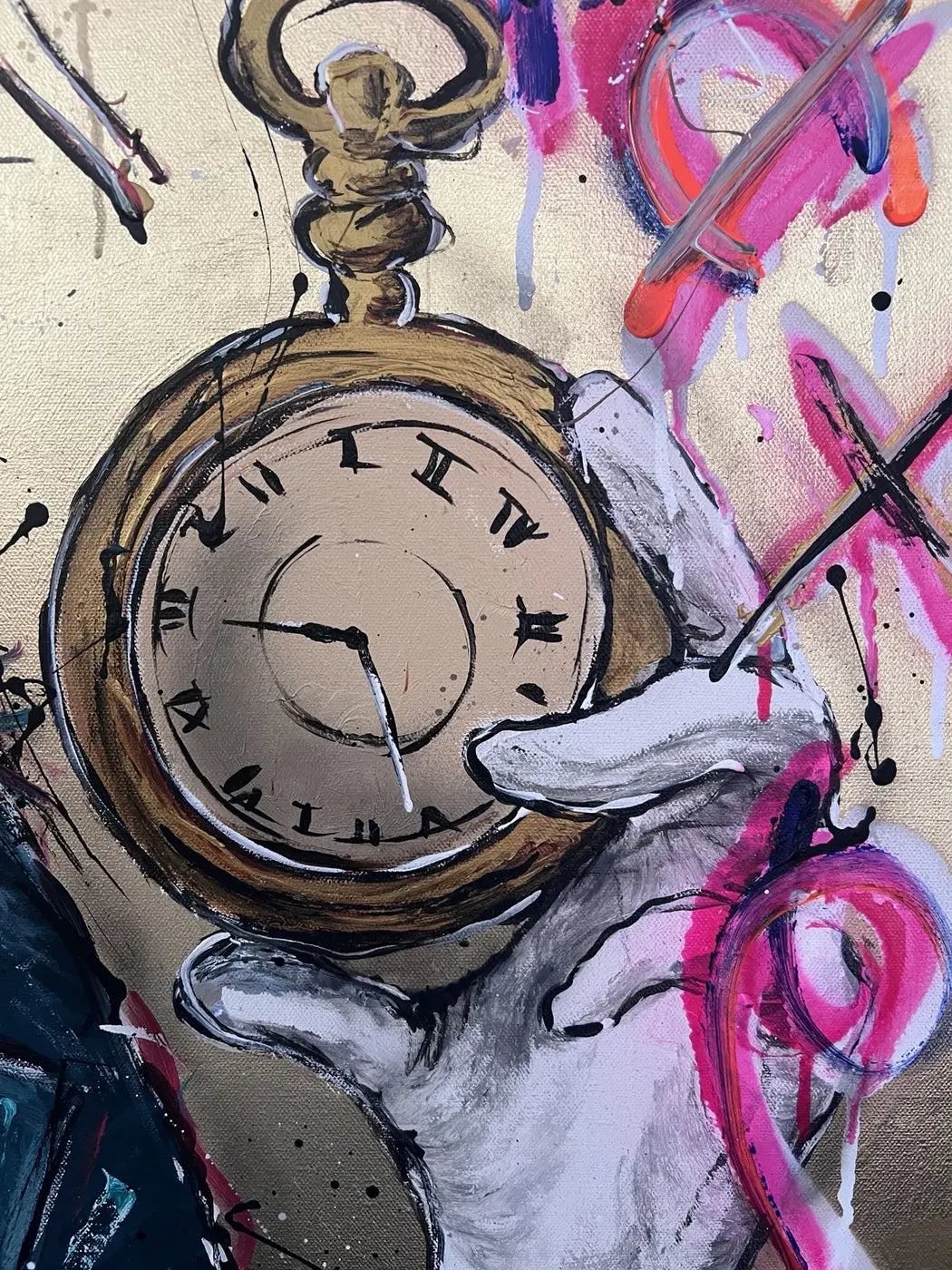 Close-up of the gold-toned pocket watch held in the rabbit’s white-gloved paw in Never too late – Party time.